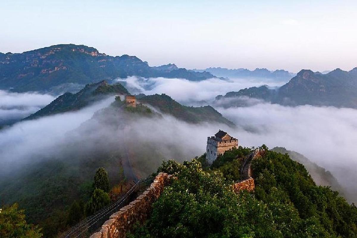 a castle on top of a mountain in the clouds