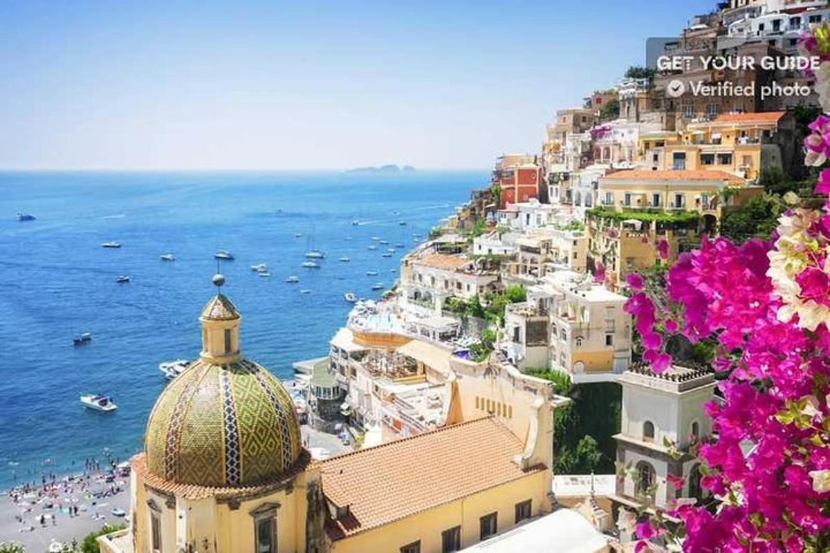 a view of the amalfi coast with buildings and the ocean