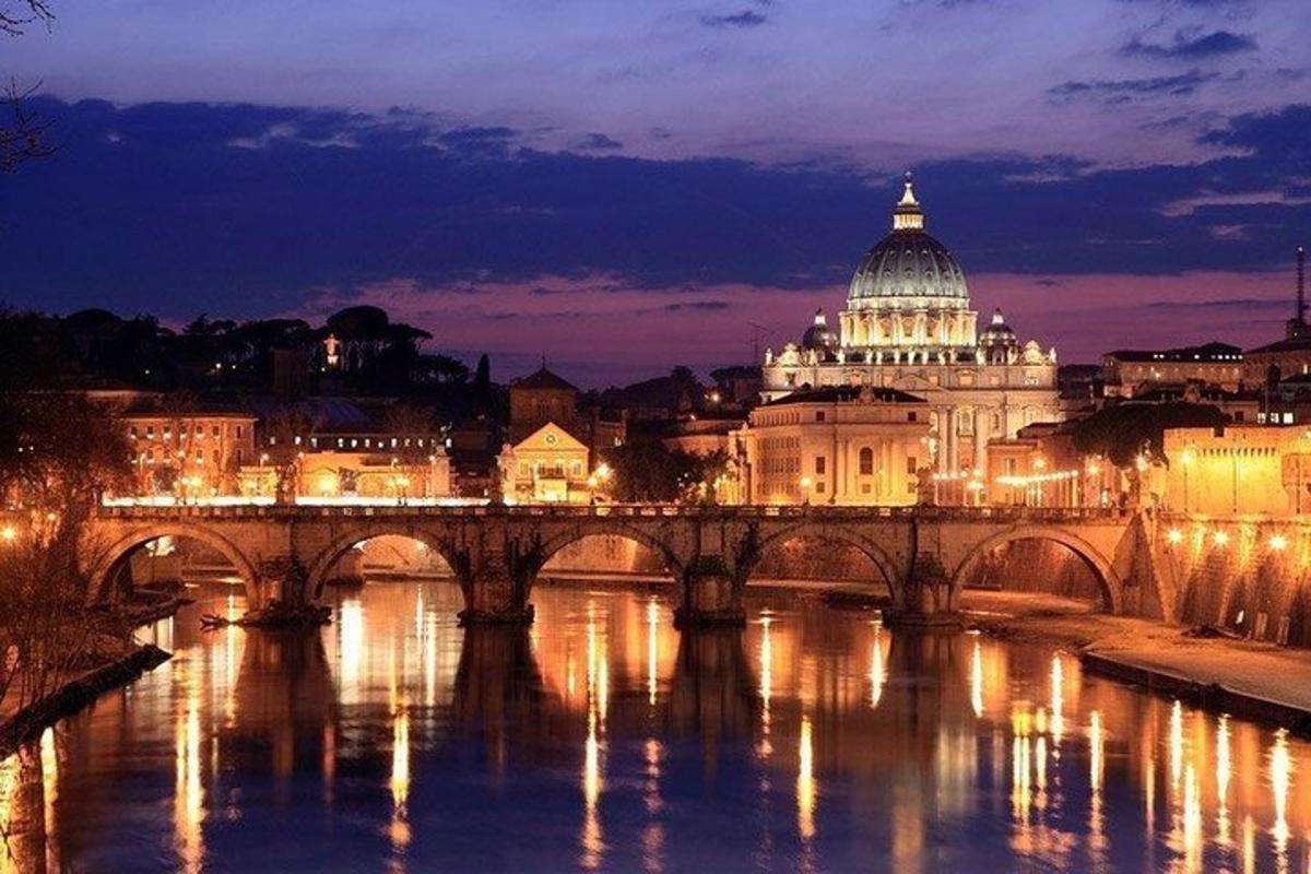 a bridge over a river in front of a building