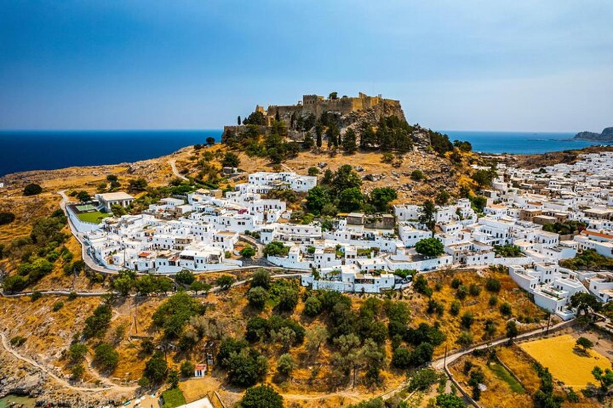 an aerial view of a village on a hill