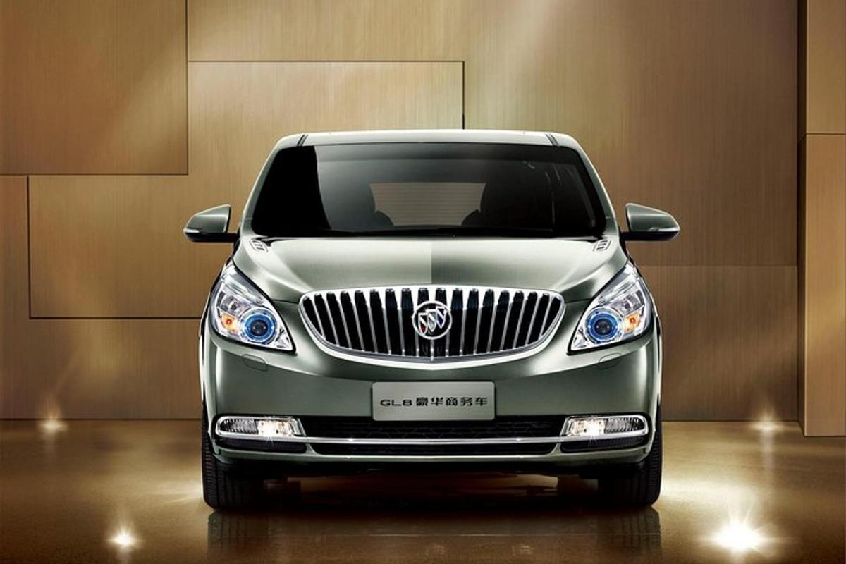 a silver car is parked in a room