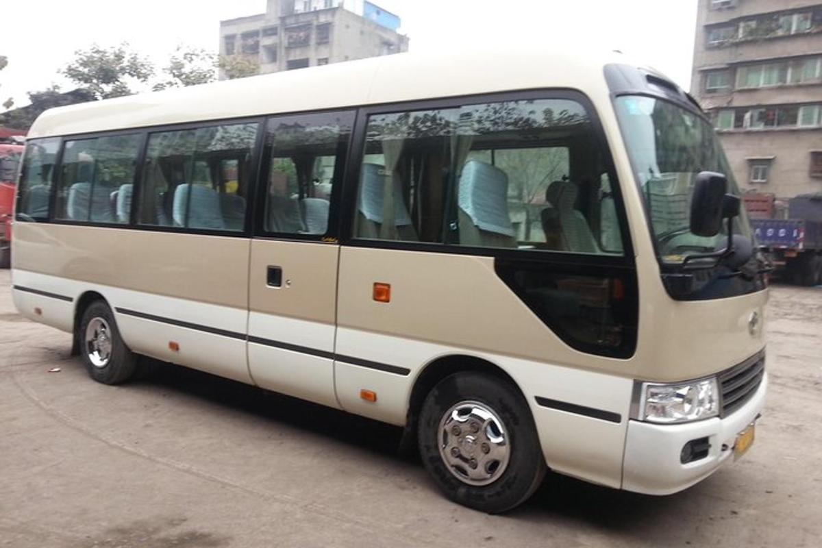 a white bus parked in a parking lot