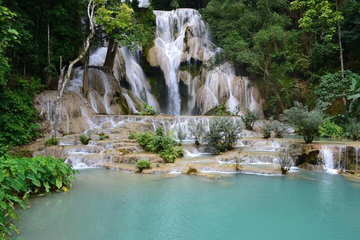 a waterfall in the middle of a pool of water