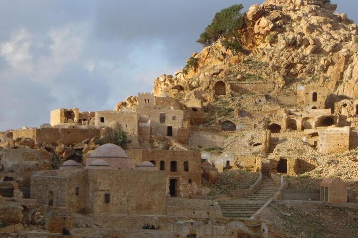 a group of buildings on the side of a mountain
