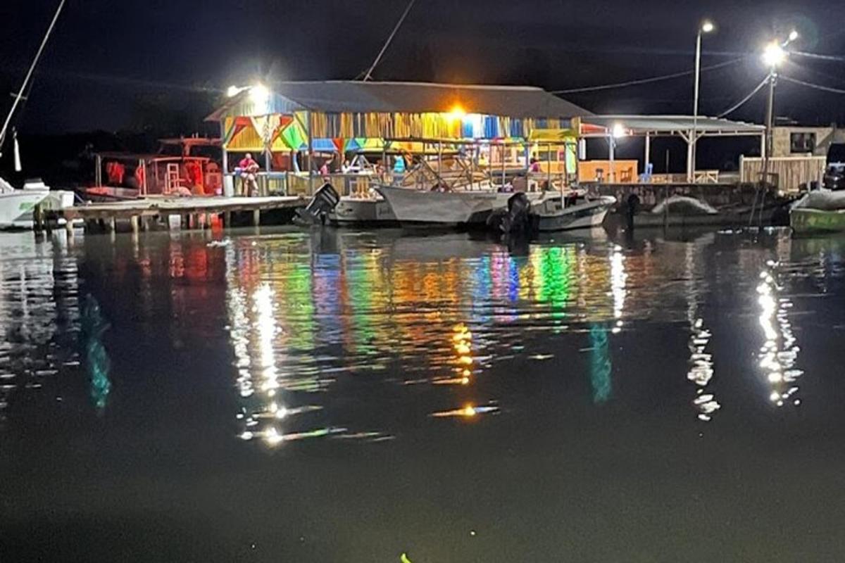 a marina at night with lights on the water