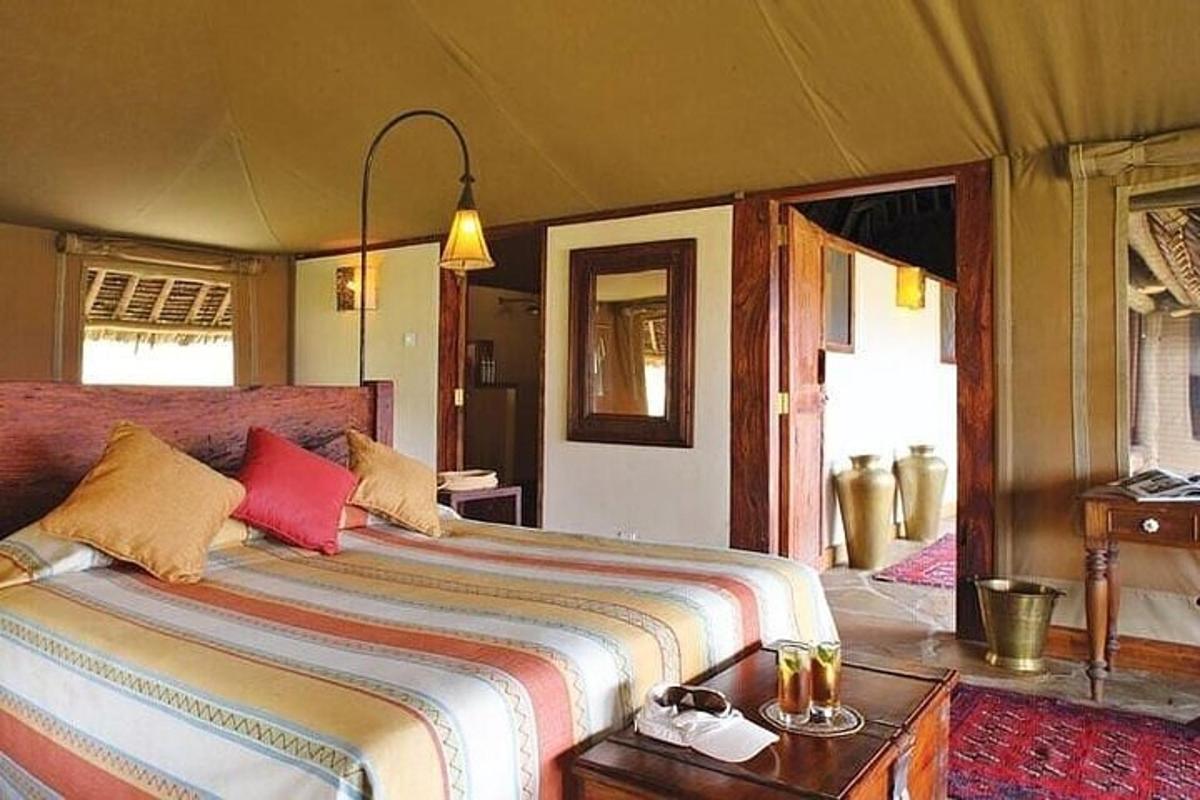 a bedroom with a large bed in a room