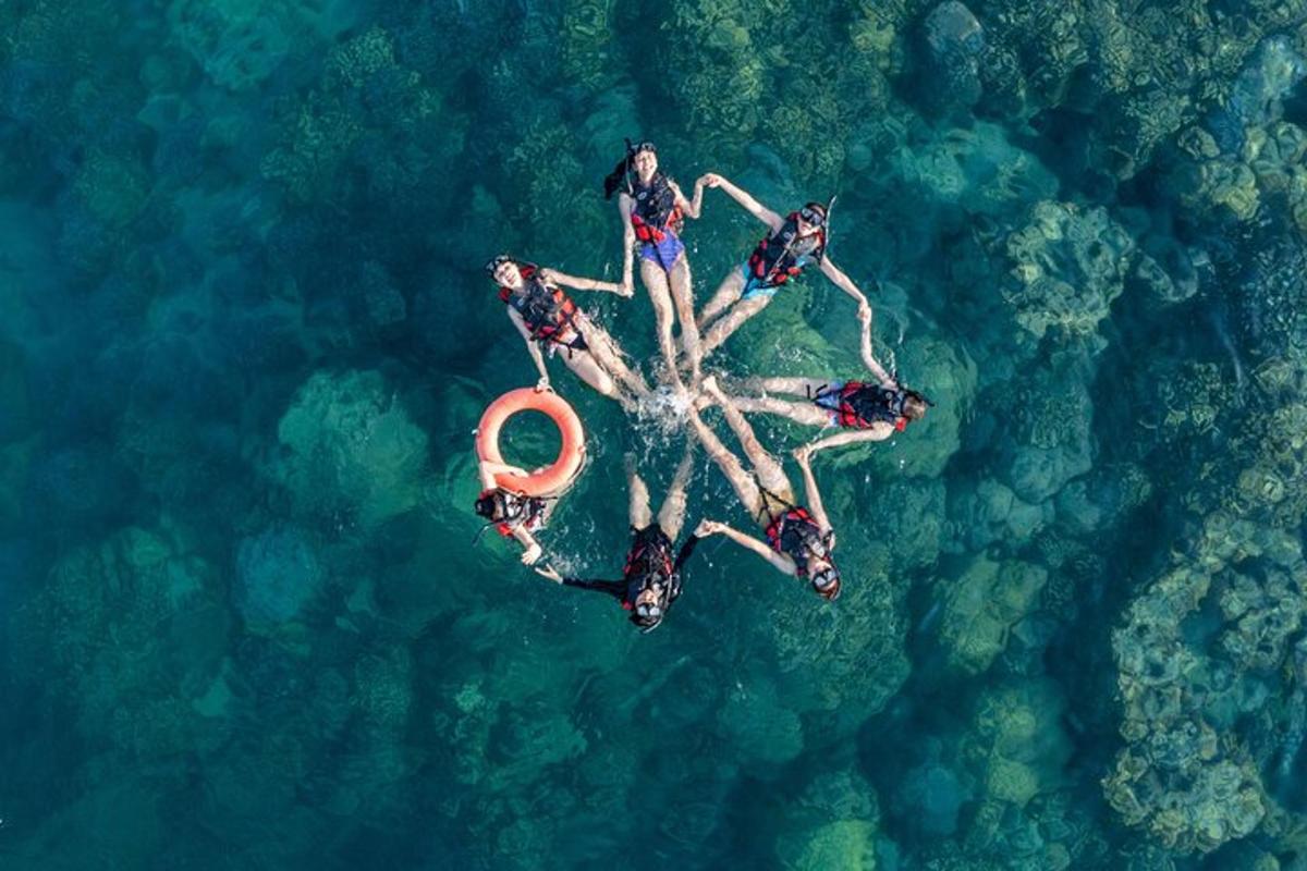 a group of people on an island in the water