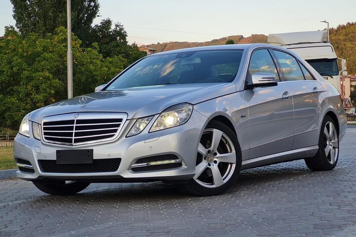 a silver car parked in a parking lot