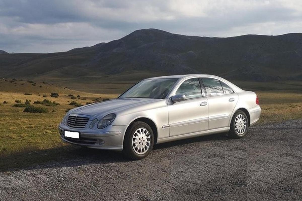 a silver car parked on the side of a road