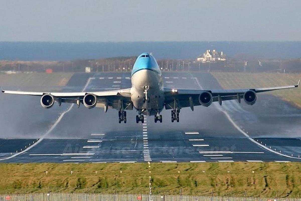 an airplane is taking off from an airport runway