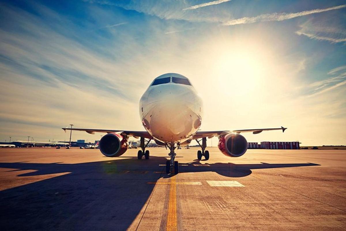 an airplane sitting on the runway at an airport