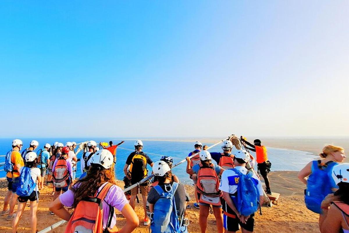 a large group of people walking up a mountain