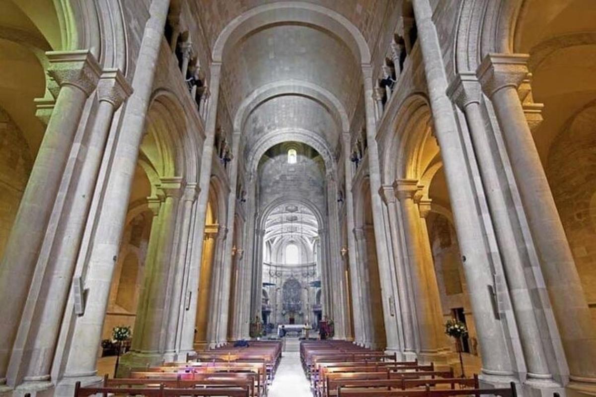 a large cathedral with rows of pews in it