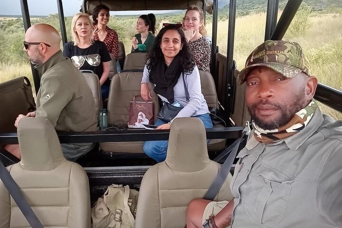a group of people sitting in the back of a bus