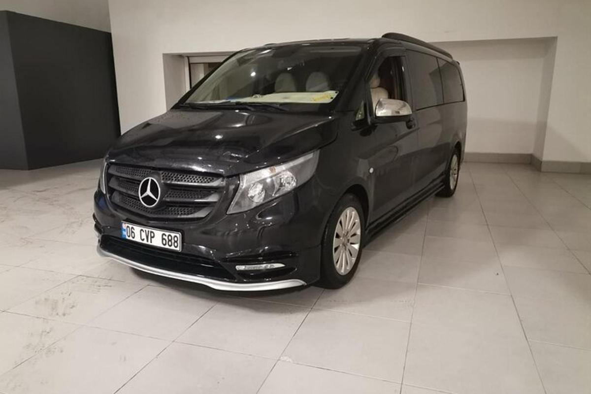 a black van is parked in a garage