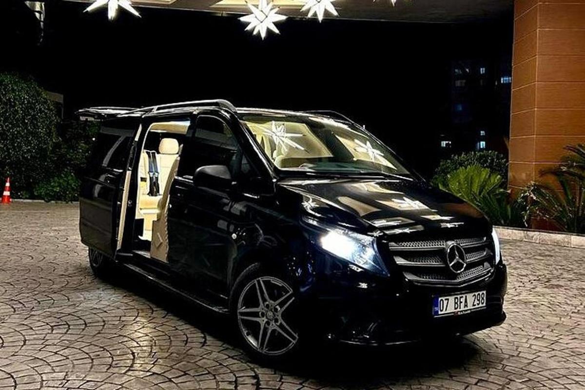 a black car parked on a brick road