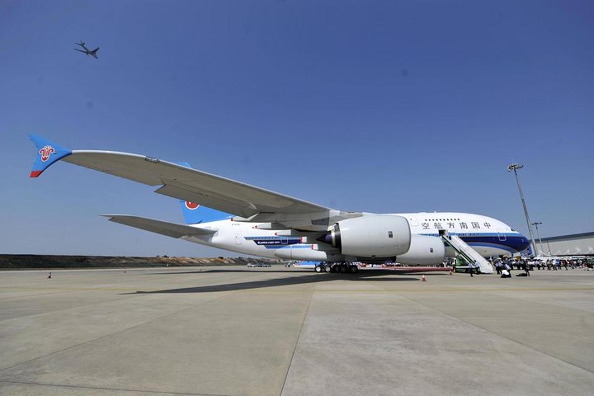 an airplane is parked on the runway at an airport