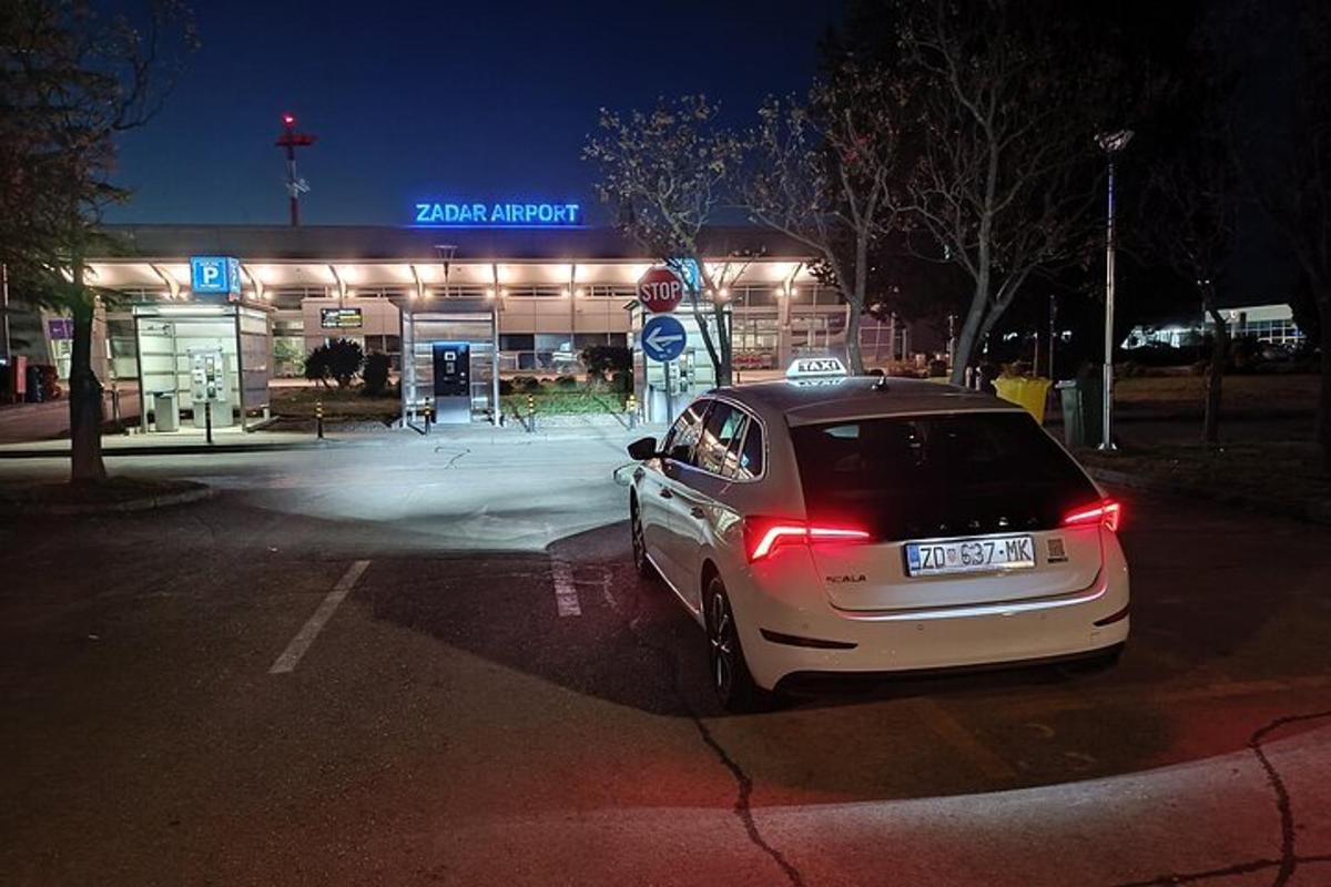 a car parked in front of a gas station at night