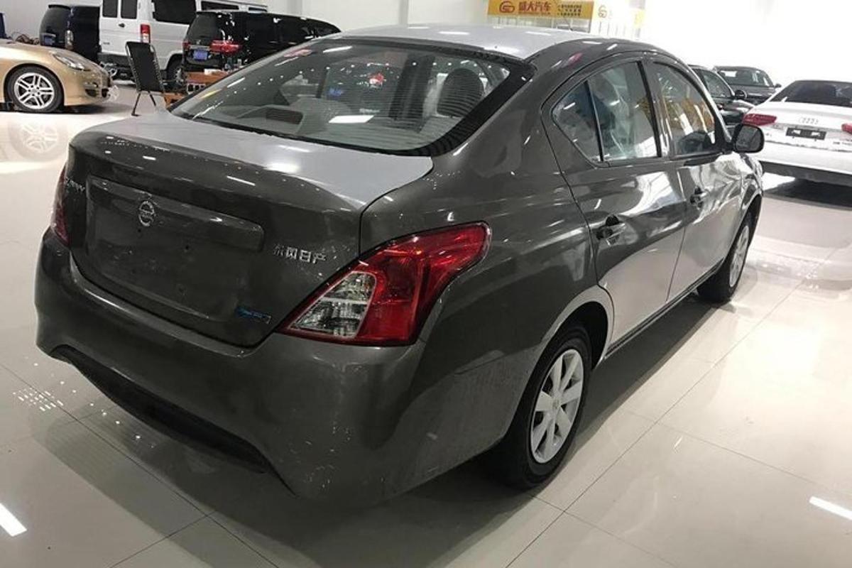 a gray car parked in a show room