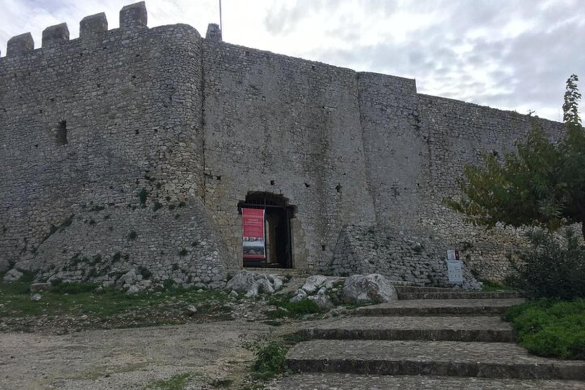 a large castle with stairs leading up to it