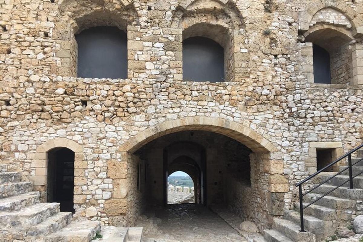 a stone wall with a tunnel in it