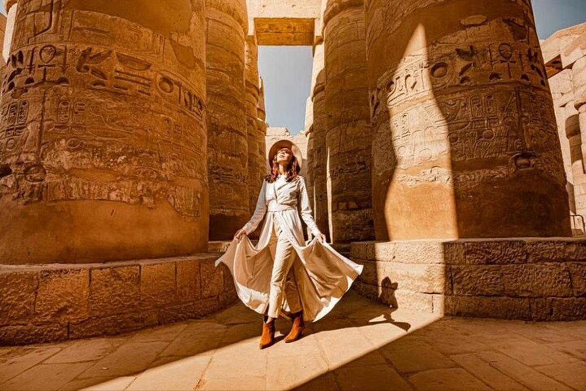 a woman in a white dress standing in a building
