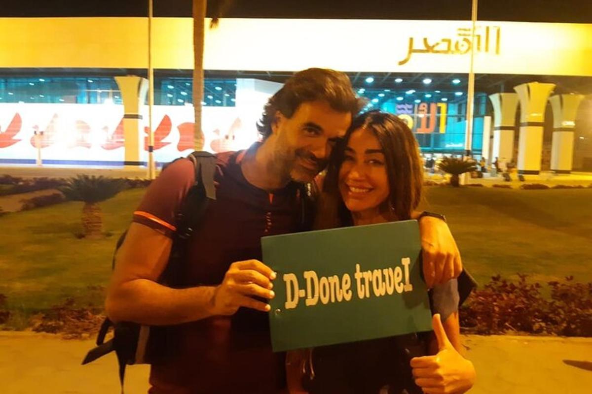 a man and a woman holding a sign that reads dance turned