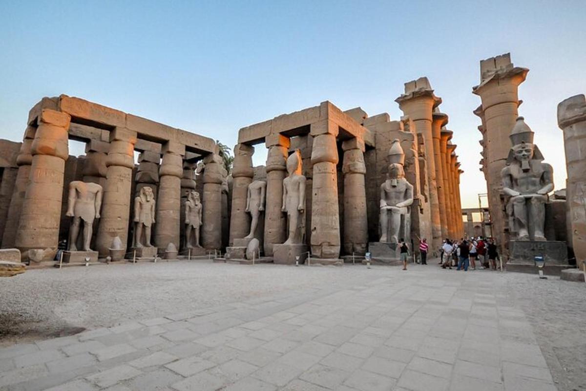 a large building with statues of people in it