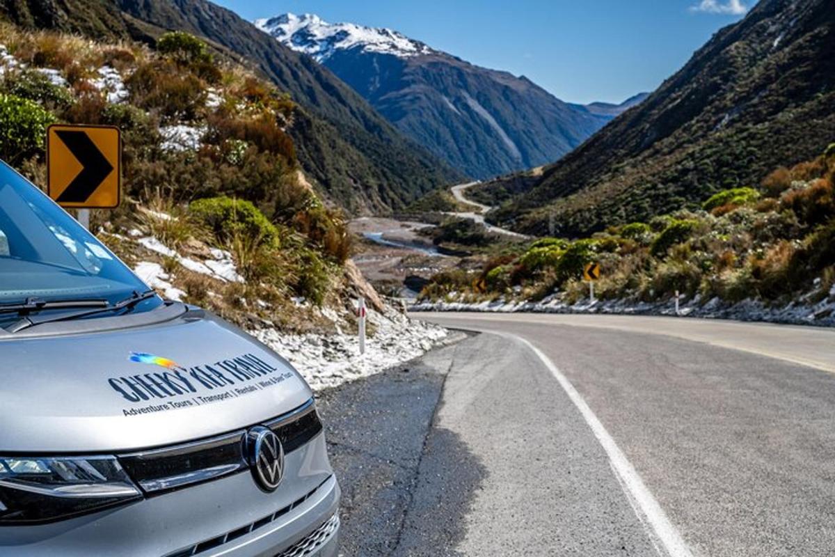 a car parked on the side of a mountain road
