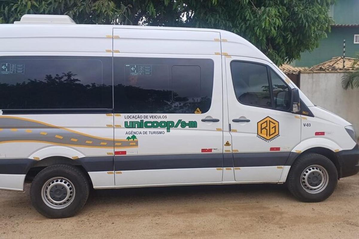sebuah van putih dengan logo di sisinya