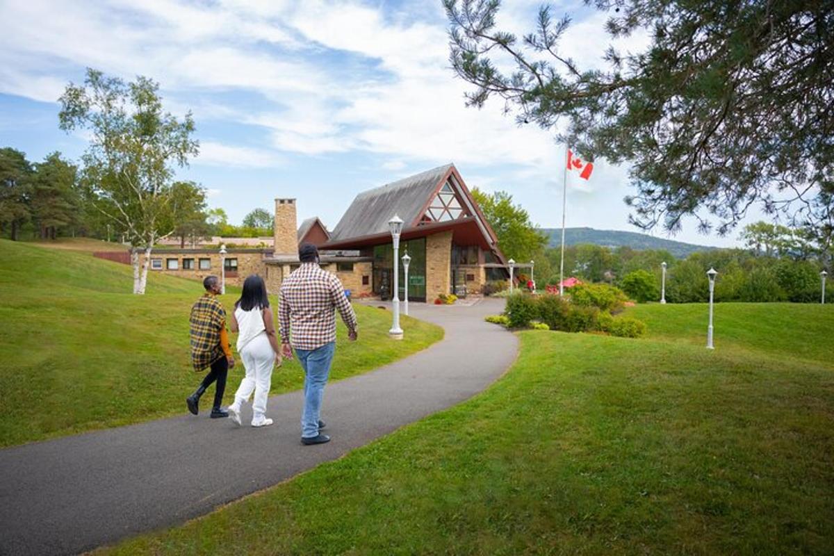 a family walking down a path in front of a building