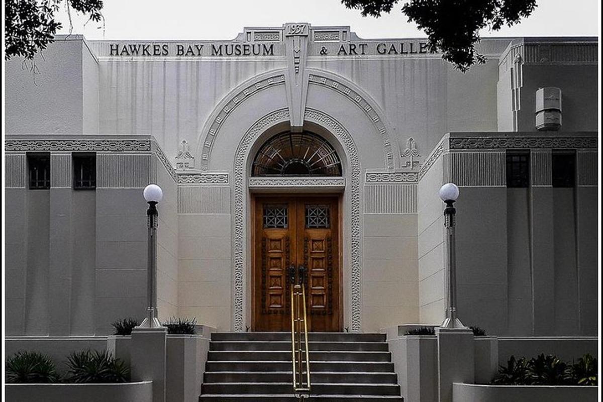 a building with a cross in front of a door