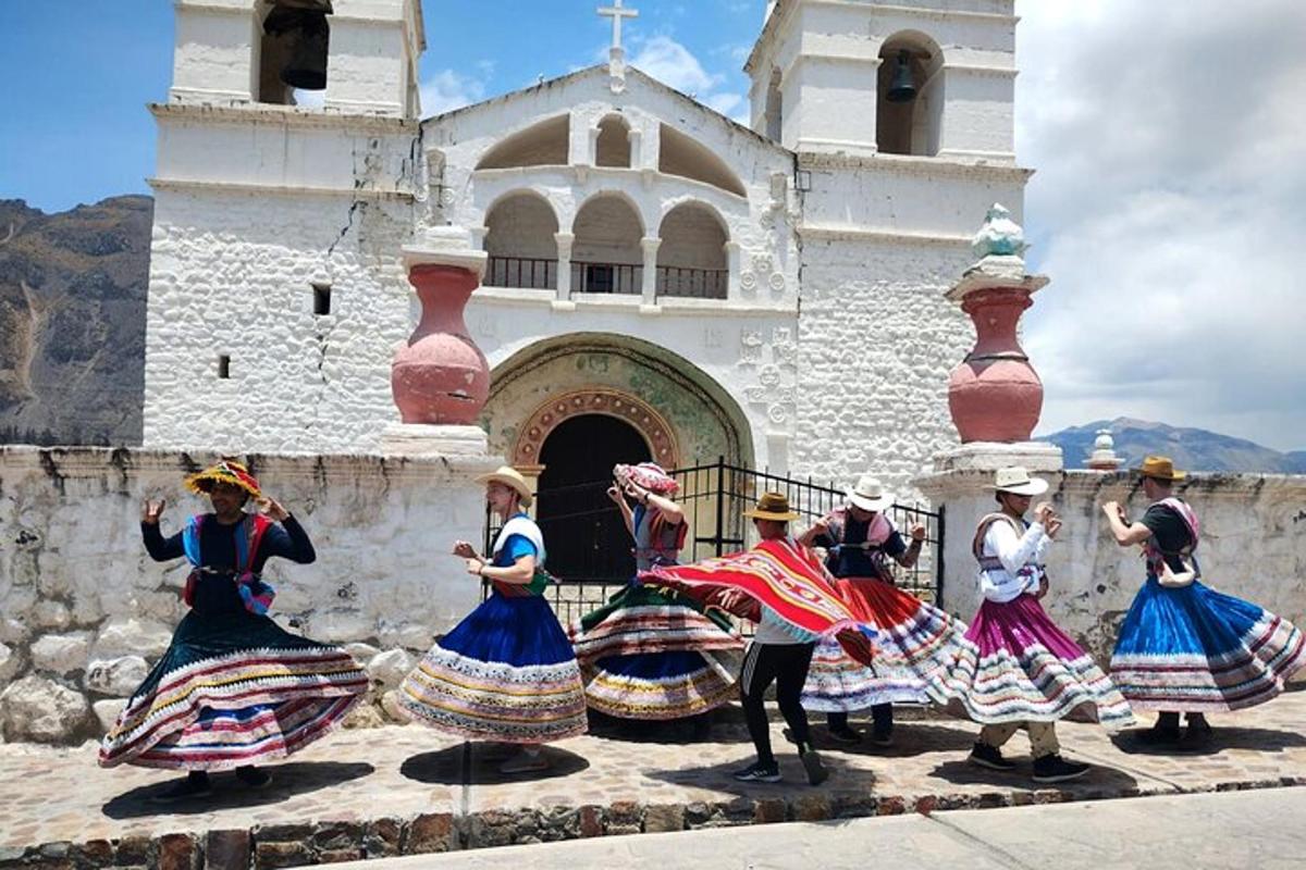 a group of people dancing in front of a church