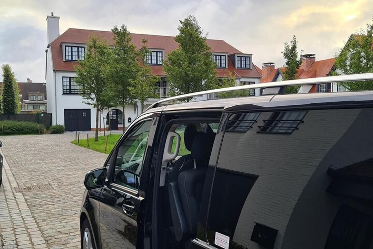 a black van parked in front of a house