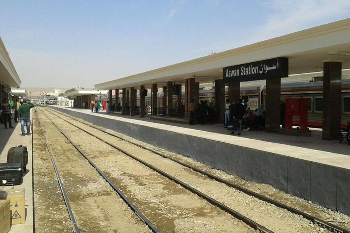 a train station with a train track in front of it