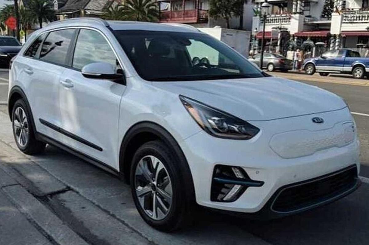 a white car parked on the side of a street