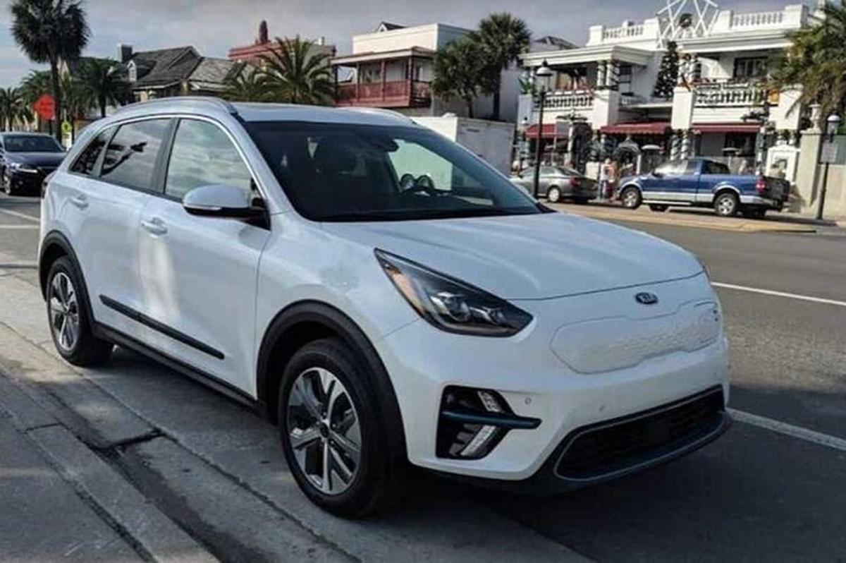 a white car parked on the side of a street