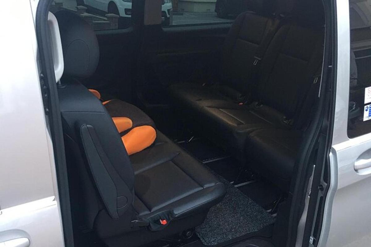 an open back seat of a car with the back door open