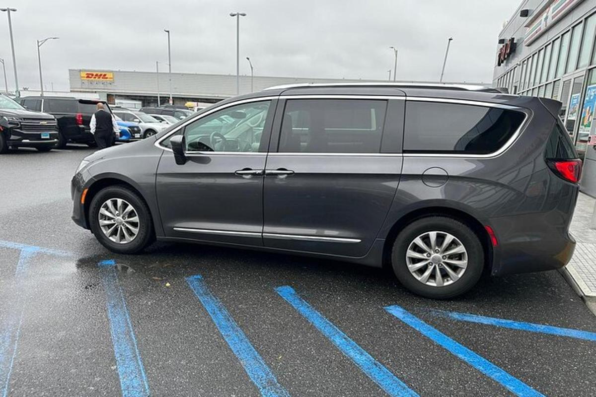 a silver van parked in a parking lot