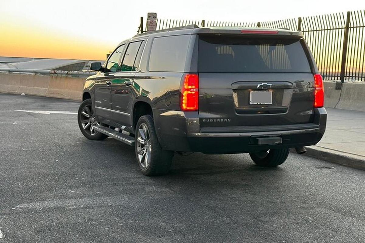 a black suv parked in a parking lot
