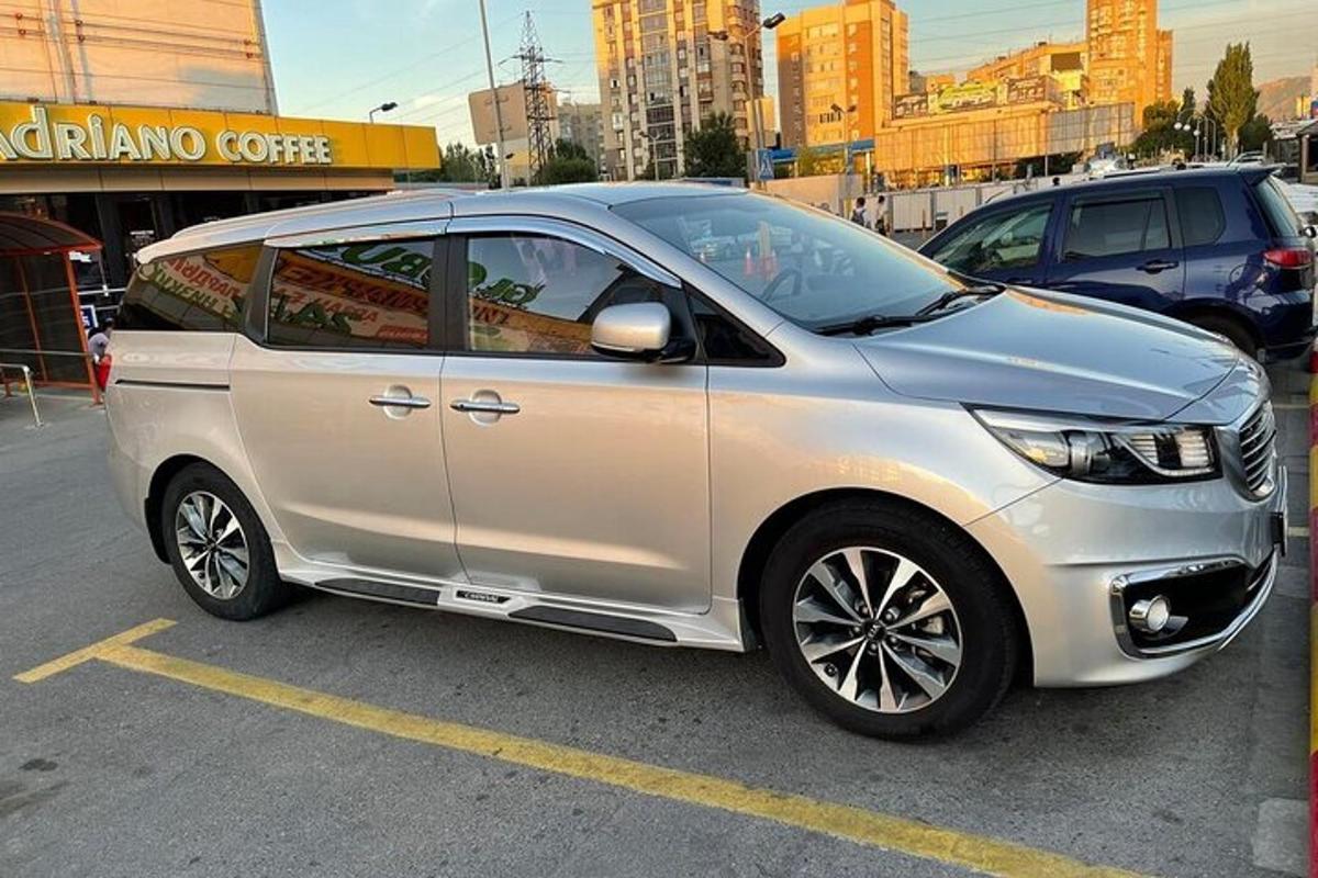 a silver car parked in a parking lot
