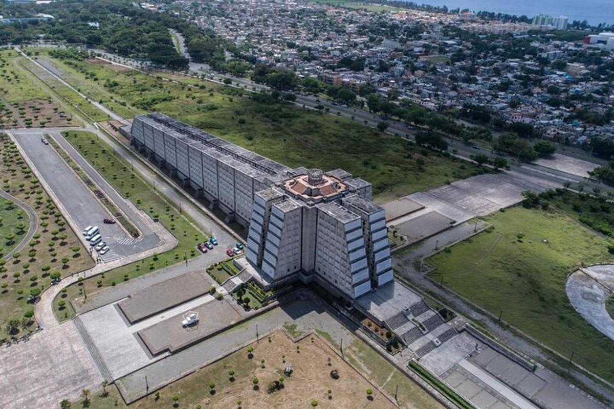 an aerial view of a large building in a park