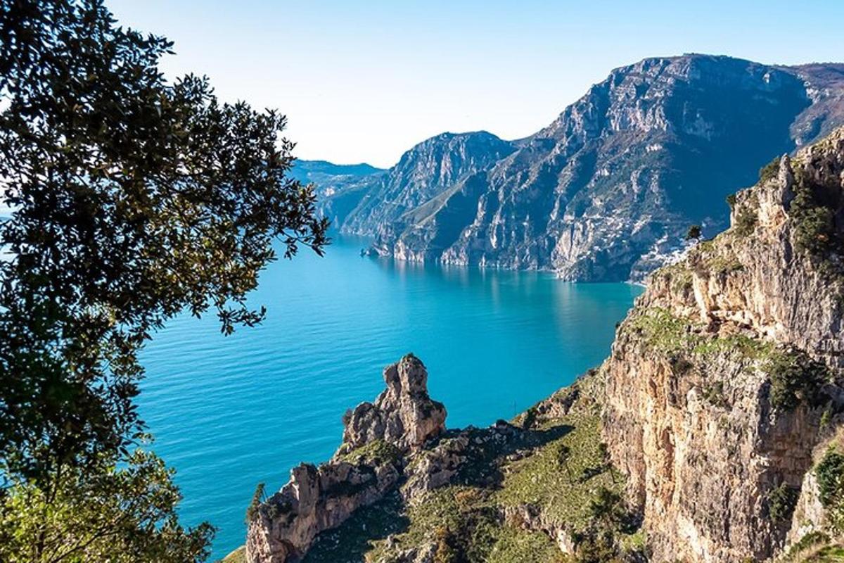a view of a large body of water between mountains