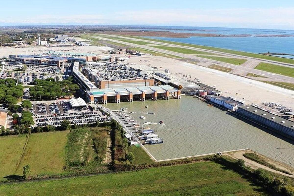 an aerial view of an airport and a beach
