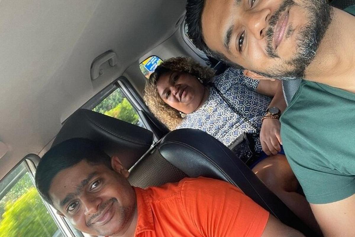 a group of people sitting in the back of a car