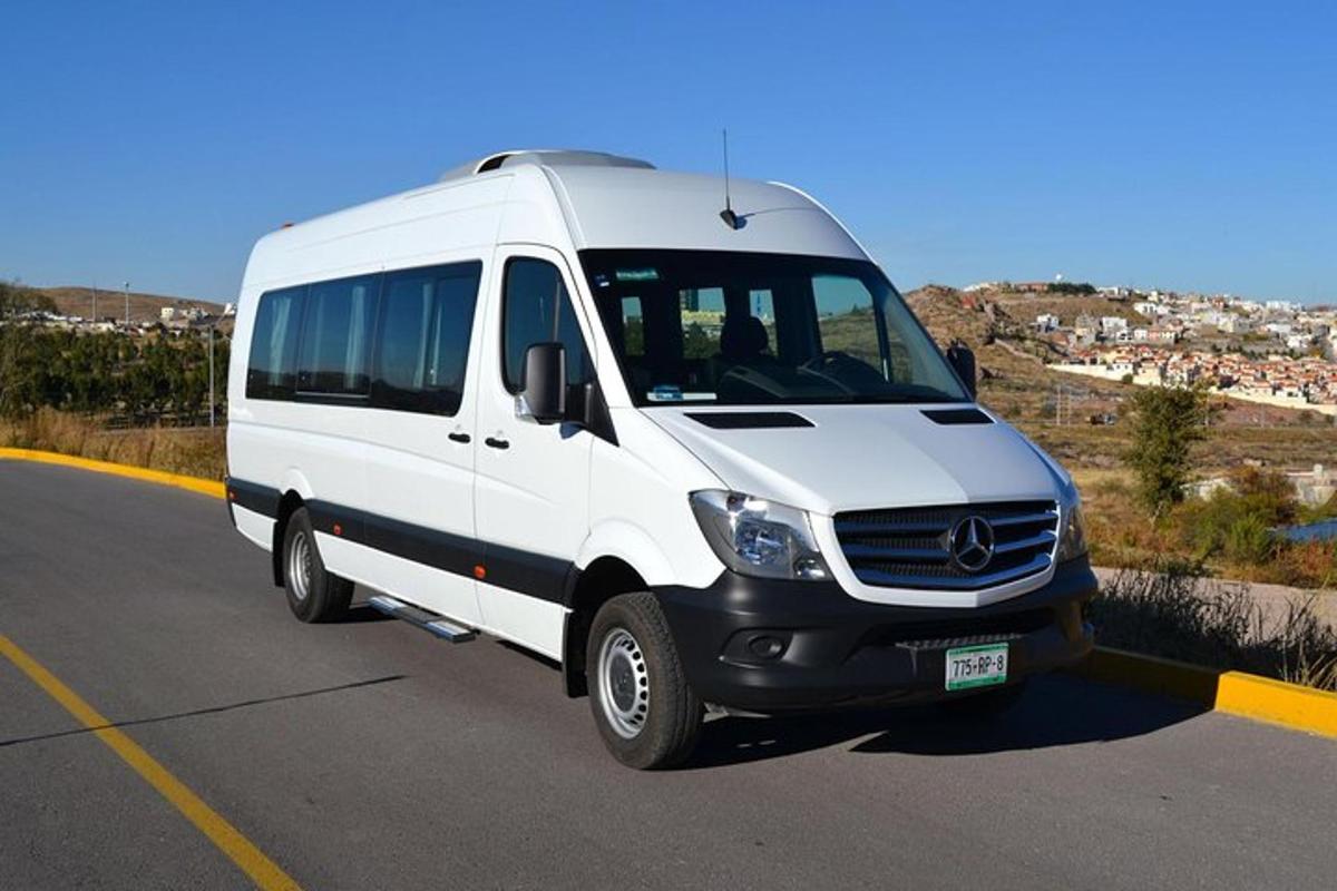 a white van is parked in a parking lot