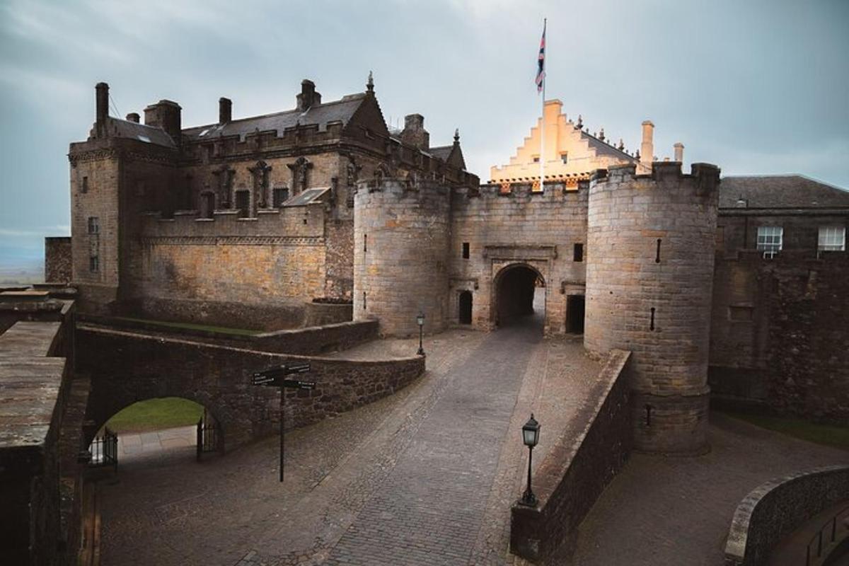 an old castle with a gate and a bridge