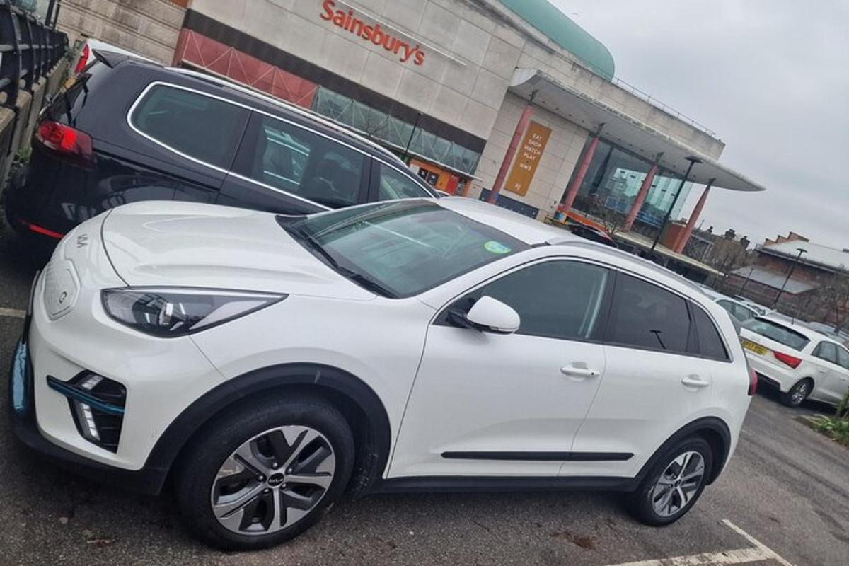 a white car parked in a parking lot