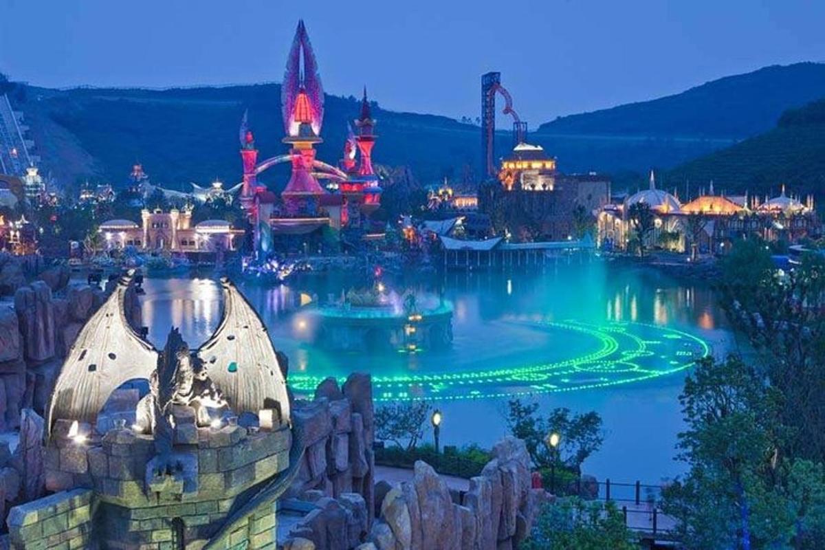 a view of the magic kingdom at night