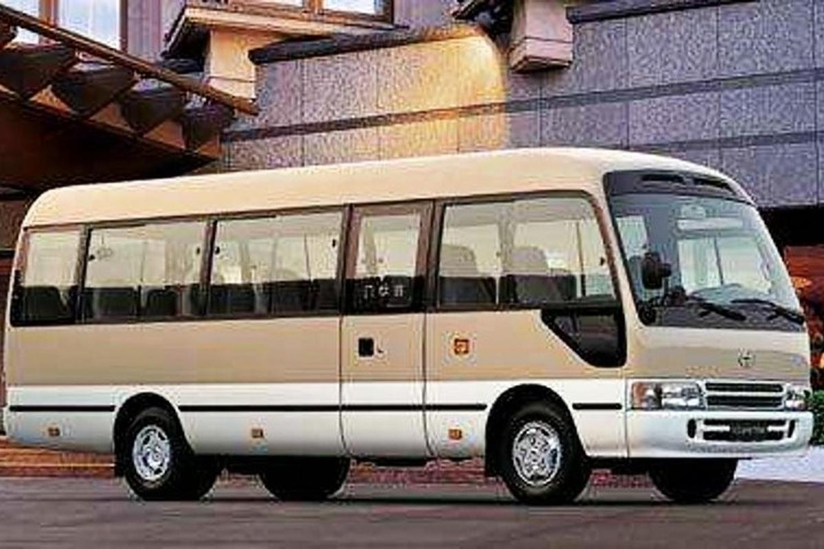 a white bus parked in a parking lot
